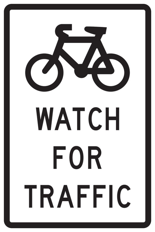 Cyclists Watch For Traffic Sign